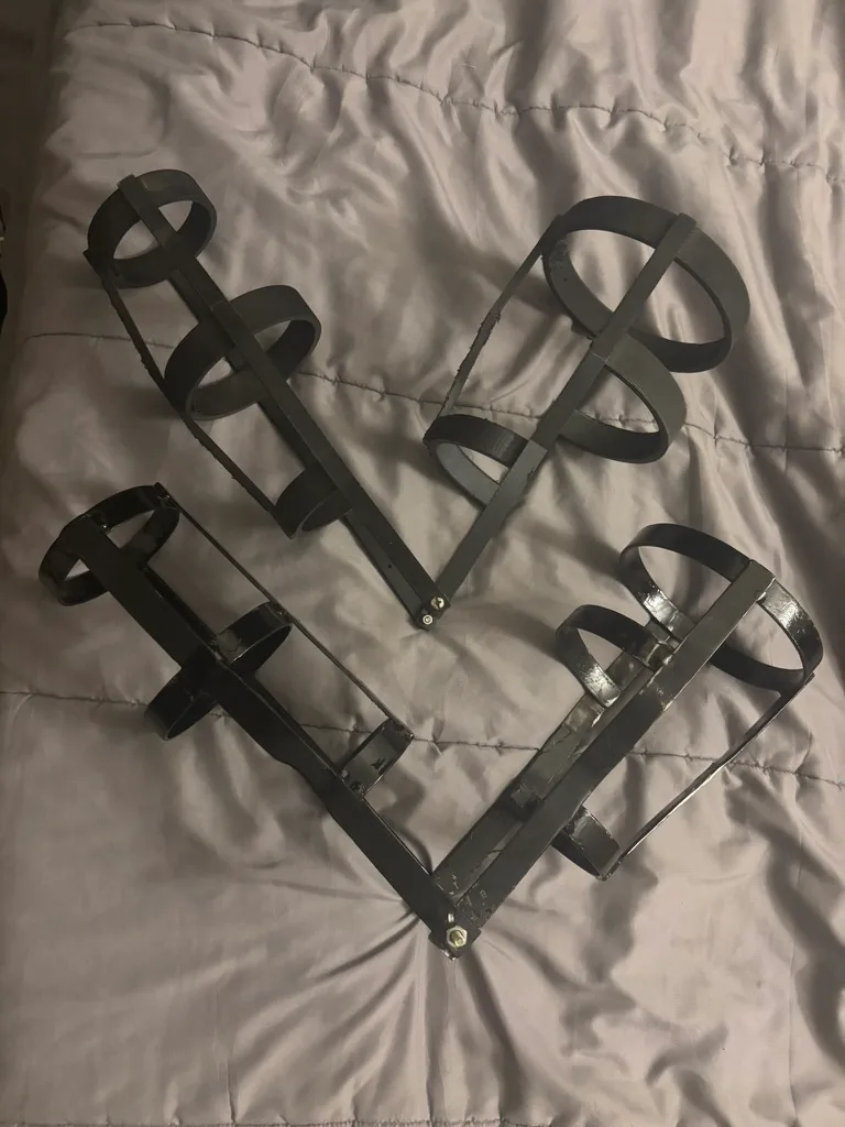 Fabricated arm cuffs and linkage brackets, cut and welded before assembly